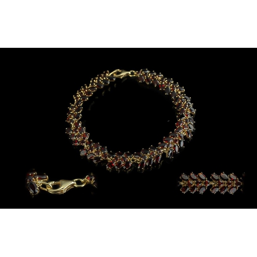 120 - Ladies - Excellent Quality 18ct Gold Fire Garnet Set Bracelet. Marked 950 - 18ct. The Well Matched a... 