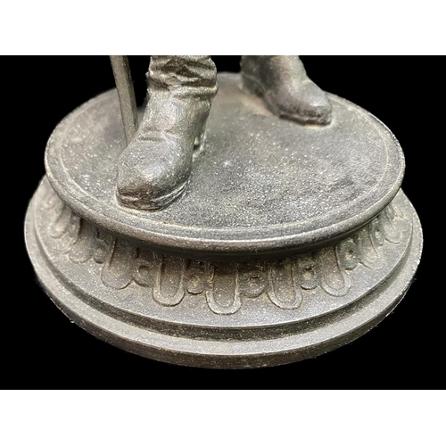 1244 - Metal Cast Figure of a Soldier, raised on a circular mount, holding a torch and sword.  Measures 16'... 