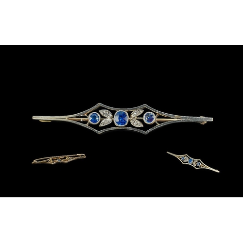 132 - 18ct Gold and Platinum Diamond & Sapphire Set Bar Brooch, with original display box.  Blue sapphires... 