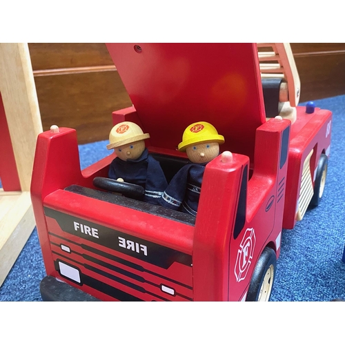 1508 - Child's Wooden Fire Station, measures 22'' high x 23'' wide, with a box of wooden fire equipment, fi... 