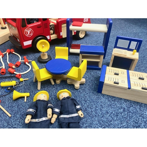 1508 - Child's Wooden Fire Station, measures 22'' high x 23'' wide, with a box of wooden fire equipment, fi... 