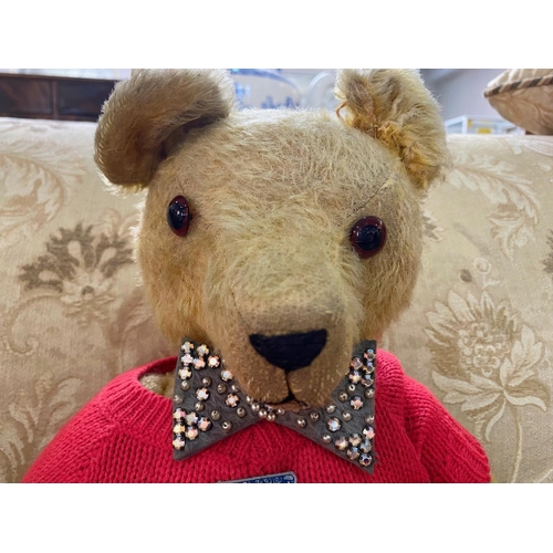 1511 - Vintage Busy Bear Teddy, moveable limbs, wearing a red sweater and bow tie.  Measures 20'' high.  To... 