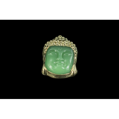 455A - Jade Buddha Pendant, carved face with yellow metal surround, measures approx. 2'' x 1''