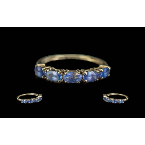 469 - 9ct Gold Tanzanite Dress Ring, eternity style set with five oval Tanzanites, ring size N.