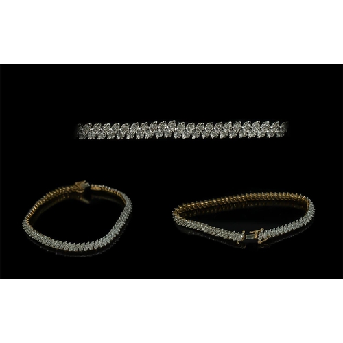 59 - 9ct Gold Well Designed and Attractive Diamond Set Line Bracelet, marked 9.375, diamonds of good colo... 