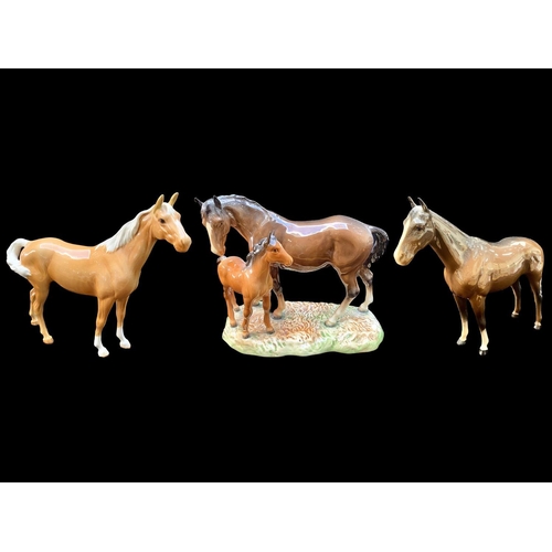 617 - Beswick Palomino Horse Figure, facing right, swish tail and gloss finish, together with a Beswick da... 