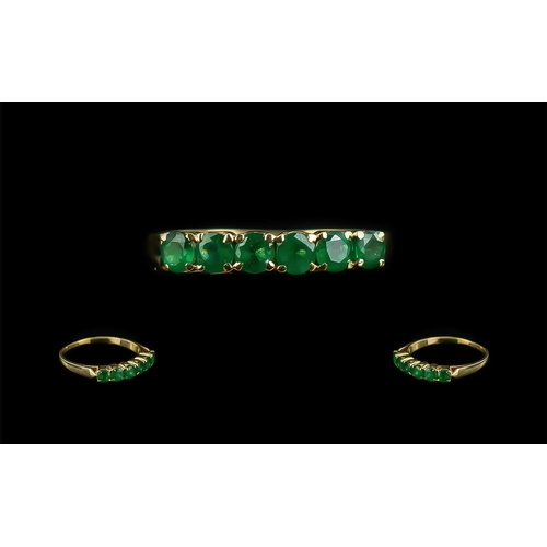 63 - Ladies 18ct Gold Attractive Six Stone Emerald Set Ring, marked to shank; the well matched, faceted e... 