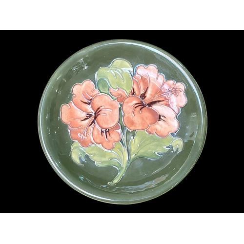 662 - Moorcroft Plate, Signed to Base, measures 8.5'' diameter.  Dark green base with peach coloured Hibis... 