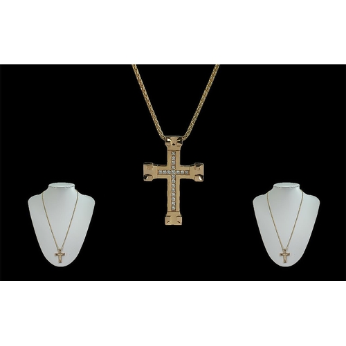 70 - 18ct Gold Cross Set With Diamonds, attached to an 18ct gold chain, both marked 750 - 18ct, the diamo... 