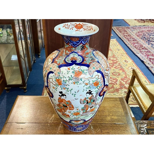 826 - A Large Japanese Imari Temple Vase the panels depicting dancing girls amongst foliage and stylised b... 