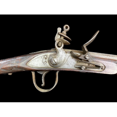 1330 - An Indian Made Flintlock Rifle, white metal mounts, barrel and lock plate with proof marks and marki... 