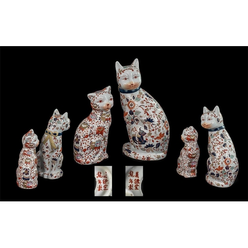 847 - Two Oriental Porcelain Cats, decorated with dragons and flowers, both marked to base.  Measure 10'' ... 