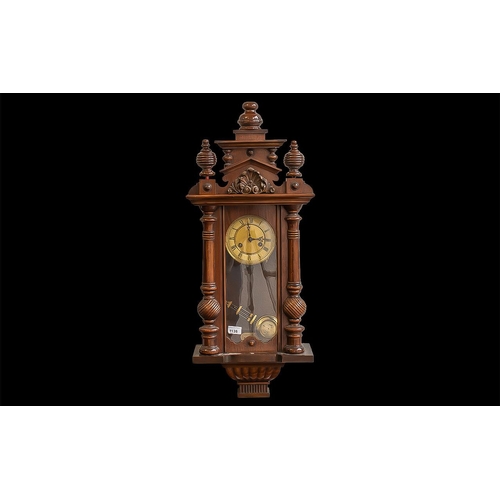 Vienna Wall Clock, working order, decorative columns, and carved finial
