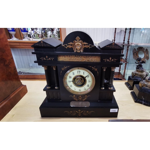 1102 - 19th Century Black Slate Architectual Clock, cream chapter dial with Arabic numerals, between four t... 