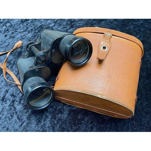 1300A - Pair of Military Field Glasses by L & G Telstar, in a tan leather carry case.