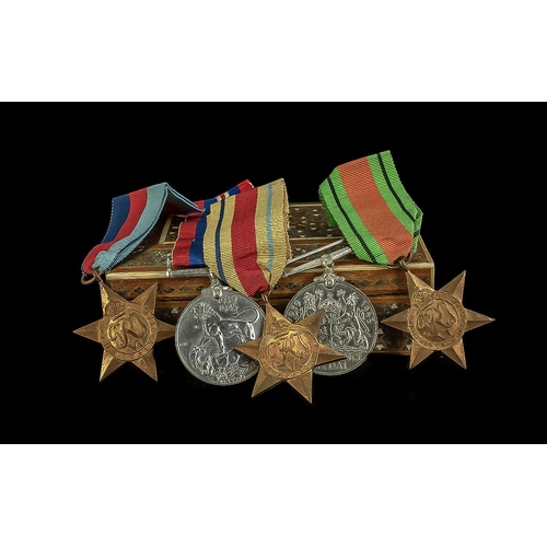 1306 - Military Interest. Two WWI Medals together with Africa, Italy and The 1939-1945 Star. Housed in a wo... 