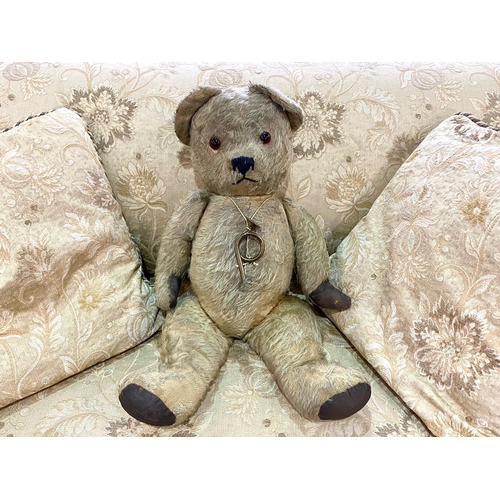 1570 - Early 20th Century Teddy Bear.  Jointed straw filled bear, padded paws, glass eyes.  Approx. 22'' ta... 