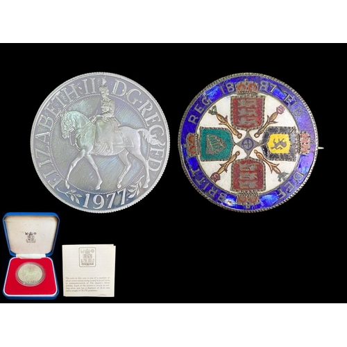 426 - Royal Mint 1977 Silver Jubilee Coin, together with a Victorian enamelled coin brooch.