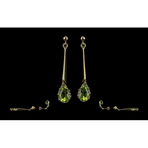 57 - Fine Pair of Attractive 9ct Gold Drop Earrings, set with tear drop  peridots;, marked 9ct, the facet... 