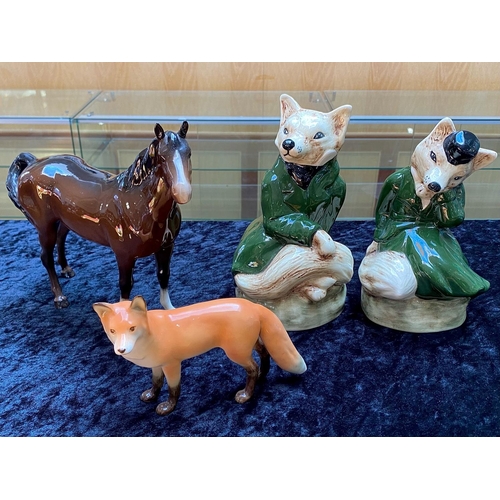 659 - Two Staffordshire Fox Figures, lady and gentleman, 9'' high. Together with a brown gloss Beswick hor... 