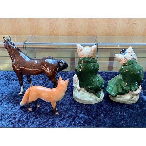 659 - Two Staffordshire Fox Figures, lady and gentleman, 9'' high. Together with a brown gloss Beswick hor... 