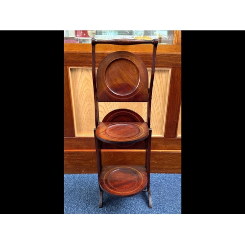 1050 - Early 20th Century Mahogany Folding Four Tier Cake Stand, double sided, measures 30'' tall.  Good co... 