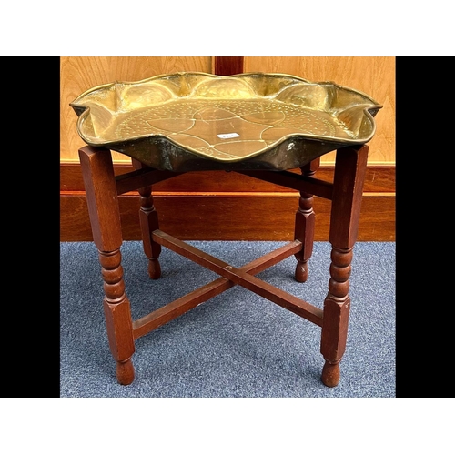 1245 - Brass Topped Moroccan Style Coffee Table, raised on wooden base, measures 22'' diameter x 21'' high,... 