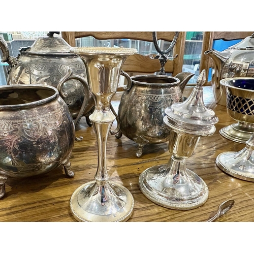 1250 - Collection of Silver Plated Ware, comprising teapots, vases, candlesticks, cups, and flatware.