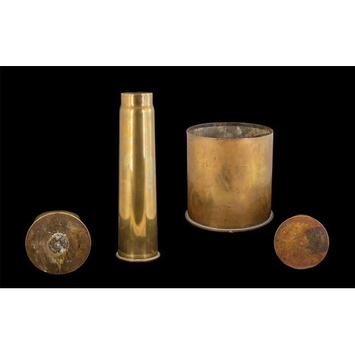 1350 - Three Brass Shell Cases, a tall brass 16'' shell, and a 9'' diameter x 9'' high shell case, and a 5.... 