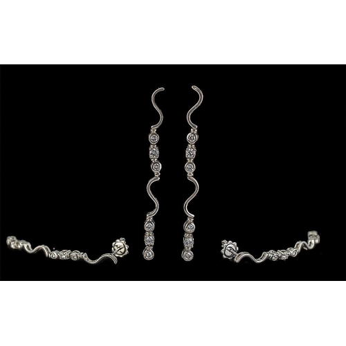 27A - Ladies Fine Pair of 18ct White Gold Diamond Set Long Earrings, Marked 750. Each Earring Set with 6 R... 