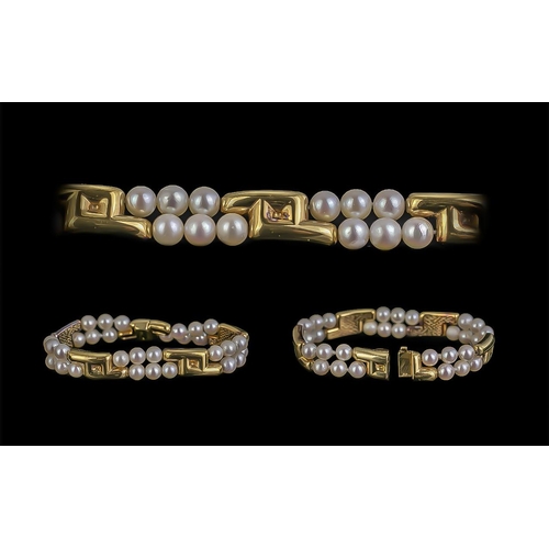 30A - A Superb Quality Ladies Signed 18ct And Cultured Pearl Set Bracelet Of Cotemporary Design. Marked 75... 