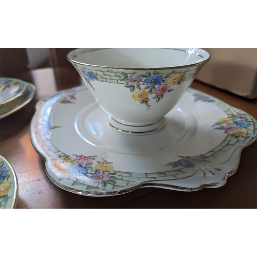 600 - Tustan China 'Plant' China Tea Set, including a cake plate, six cups, 6 saucers, five side plates, a... 