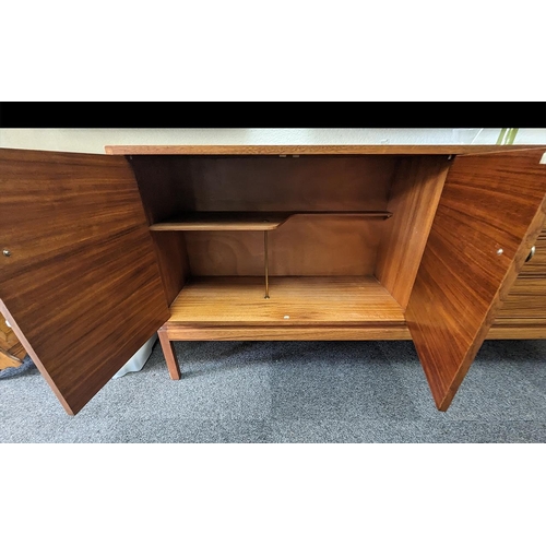 1021 - Stylish Teak Sideboard, with two cupboards and four drawers, measures 176 cm length, 43 cm depth and... 