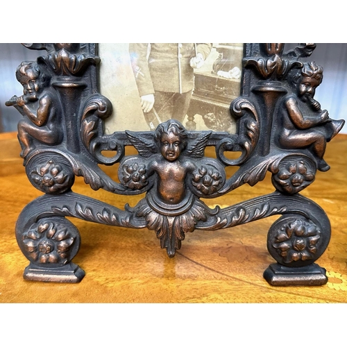 1236 - A Pair of Late Victorian Cast Metal Copper Patinated Easel Back Photo Frames with Cherub Finials, me... 