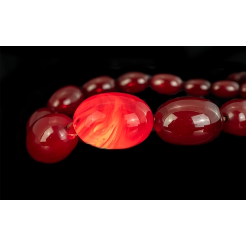 129 - Early 20th Century Superb Cherry Amber Graduated Beaded Necklace of excellent colour, circa 1920s; l... 