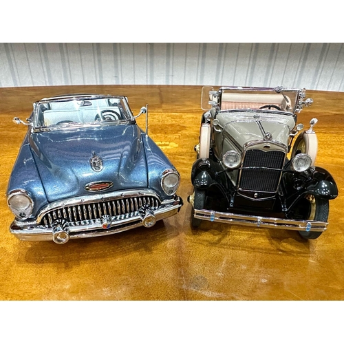 1389 - Two Danbury Mint Collector's Classic Cars, a 1931 Ford Model A Roadster in tan, and a 1953 Buick Sky... 