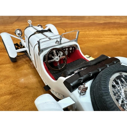 1392 - Two Danbury Mint Collector's Classic Cars, 1931 Mercedes-Benz SSKL, white, together with a 1938 Roll... 