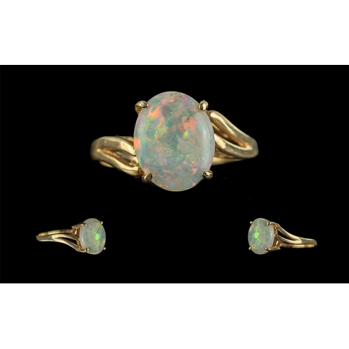 233 - Ladies Attractive 9ct Gold Single Stone Opal Set Ring, Gold Marks to Shank, The Oval Shaped Opal of ... 