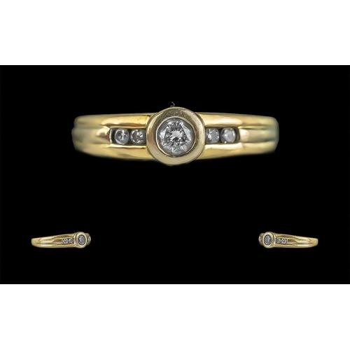 285 - Yellow Metal Diamond Set Dress Ring, central round cut diamond with diamond shoulders.  Ring size O.