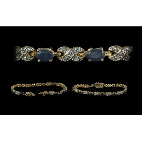 295A - Gem Set Yellow Metal Bracelet, Ladies Bracelet Set with Oval Dark Blue Stones & White Stones In The ... 