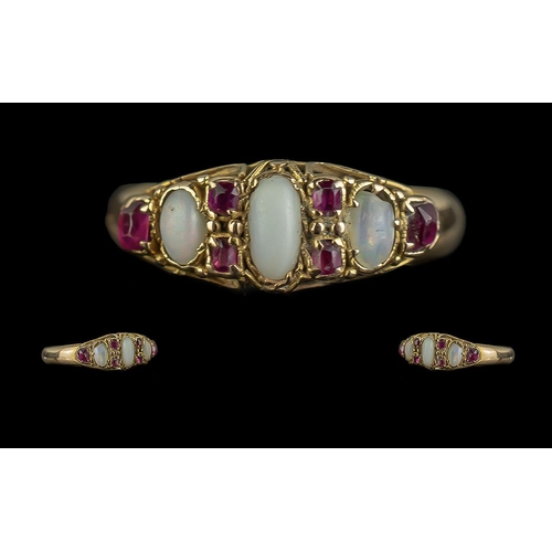 325 - An Antique 18ct Gold Opal & Ruby Ring, three opals set between ruby spacers.