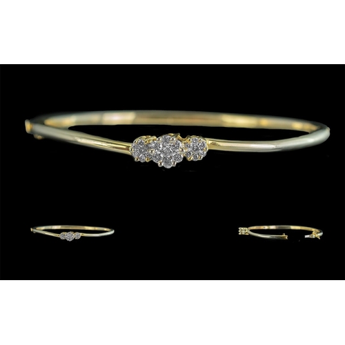 41 - 14ct Gold Good Quality Diamond Set Hinged Bangle, marked 14ct, with three diamond set clusters of ex... 