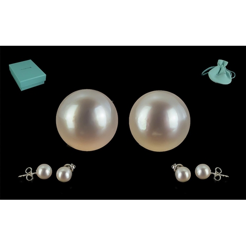 8B - Tiffany & Co. Pair of Pearl Studs, set in 18ct white gold, for pierced ears.  In original Tiffany so... 