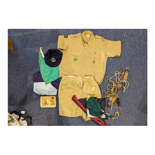 1568 - Vintage Scout Uniform comprising shorts and shirt, together with neck scarves, toggles, a school cap... 