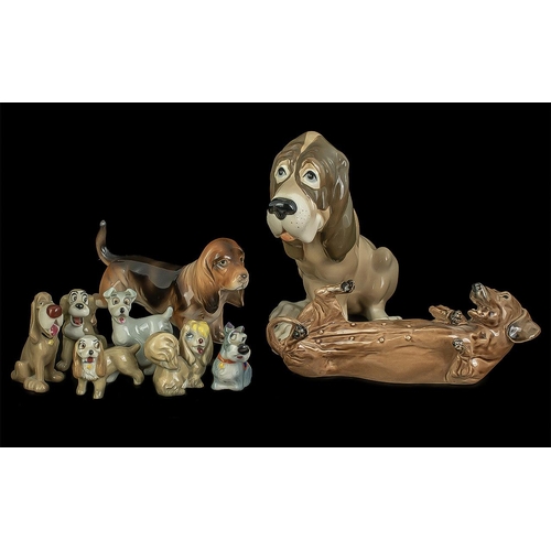 1570 - Collection of Dog Figures, including a Bassett Hound, two Daschunds, and six miniature cartoon dogs.