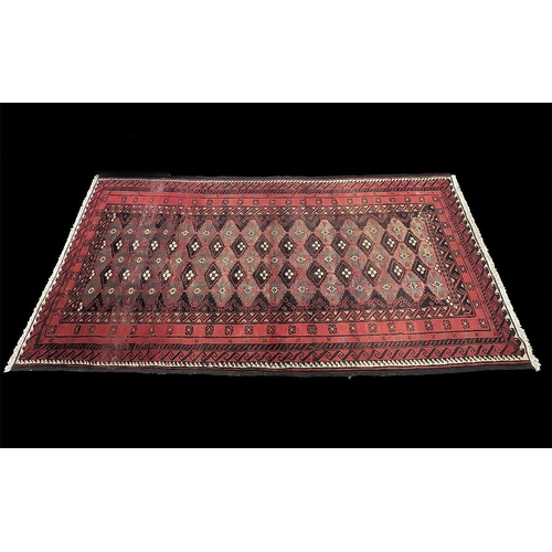 1027 - Red Ground Persian Bluchi Full Pile Nomadic Rug, measures 270 x 131.