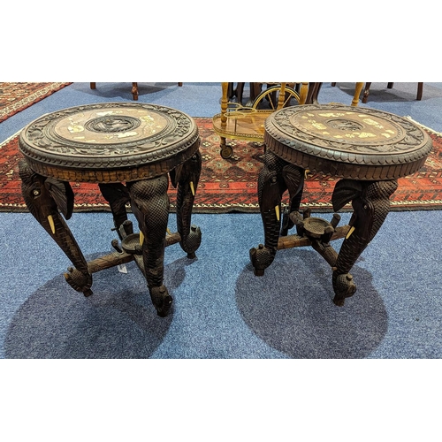 1045 - Two Carved Indian Elephant Tables, inlaid with elephant and camel figures to top, raised on four car... 