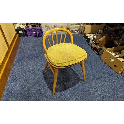 1050 - Ercol Low Back Dressing Chair, spindle back, turned legs.  Detachable cushioned seat.  Height 25'' x... 