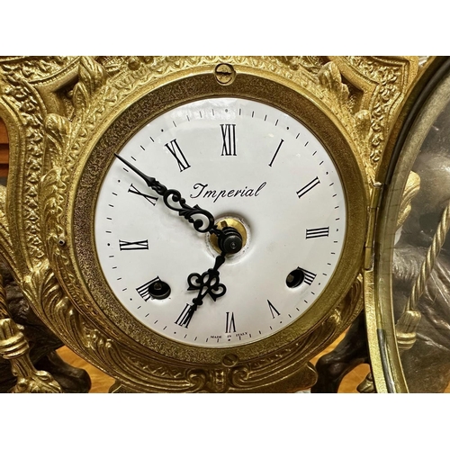 1110 - Louis XV Style Brass Clock, white dial with Roman numerals, marked Imperial, made in Italy.  Lyre sh... 