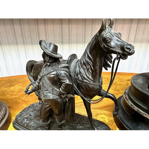 1304 - Bronzed Effect Cavalier Statue with Horse, height 7.5'', together with two spelter figures, one of a... 